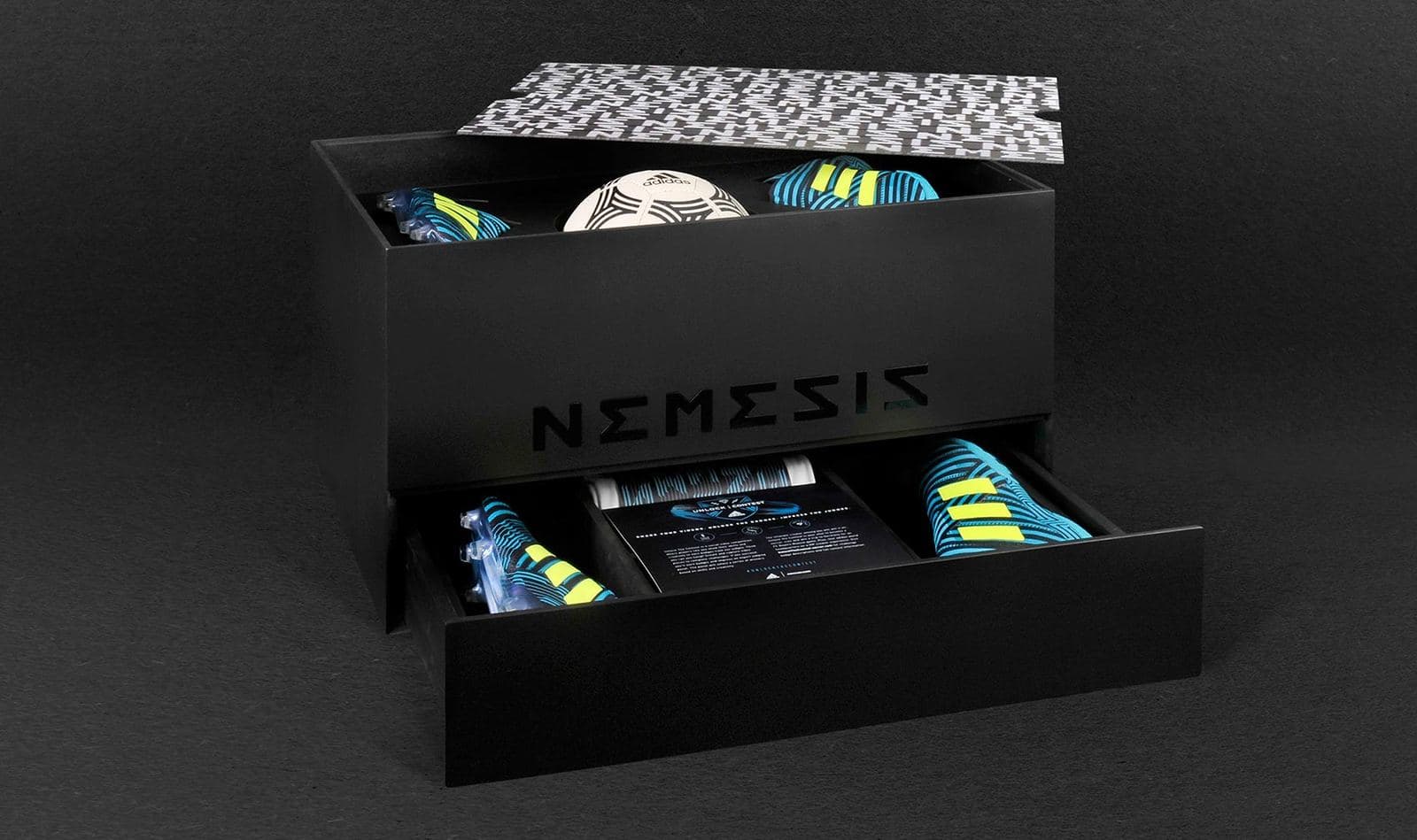 Branding detail showing debossed spot UV lettering on matte black rigid-box exterior