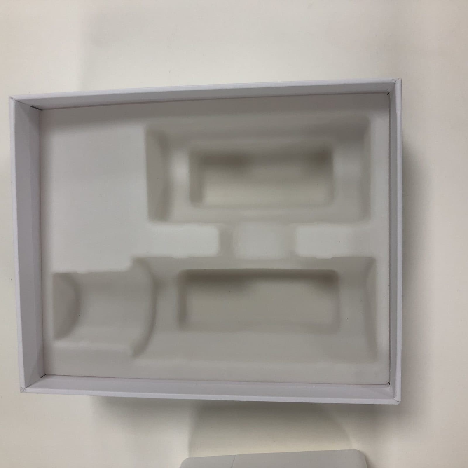 Molded fiber tray cavity verified against the specification — depth, wall thickness, and fit tolerances all documented