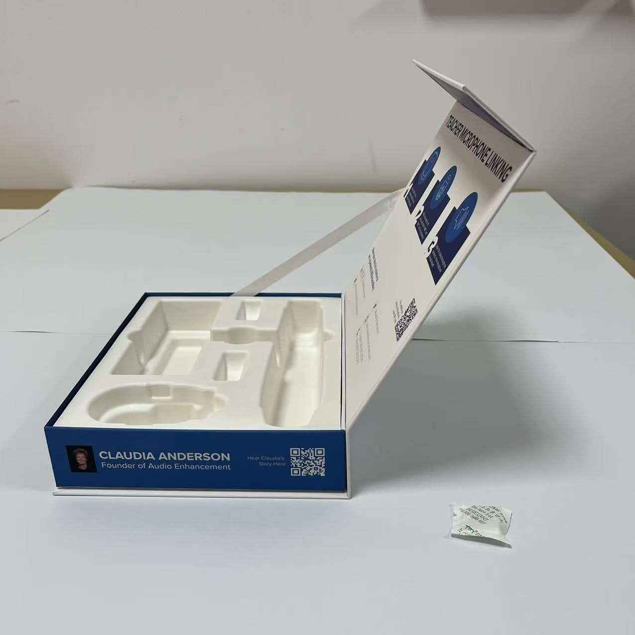Audio Enhancement pre-production sample from a side angle showing tray depth, hinge geometry, and panel registration