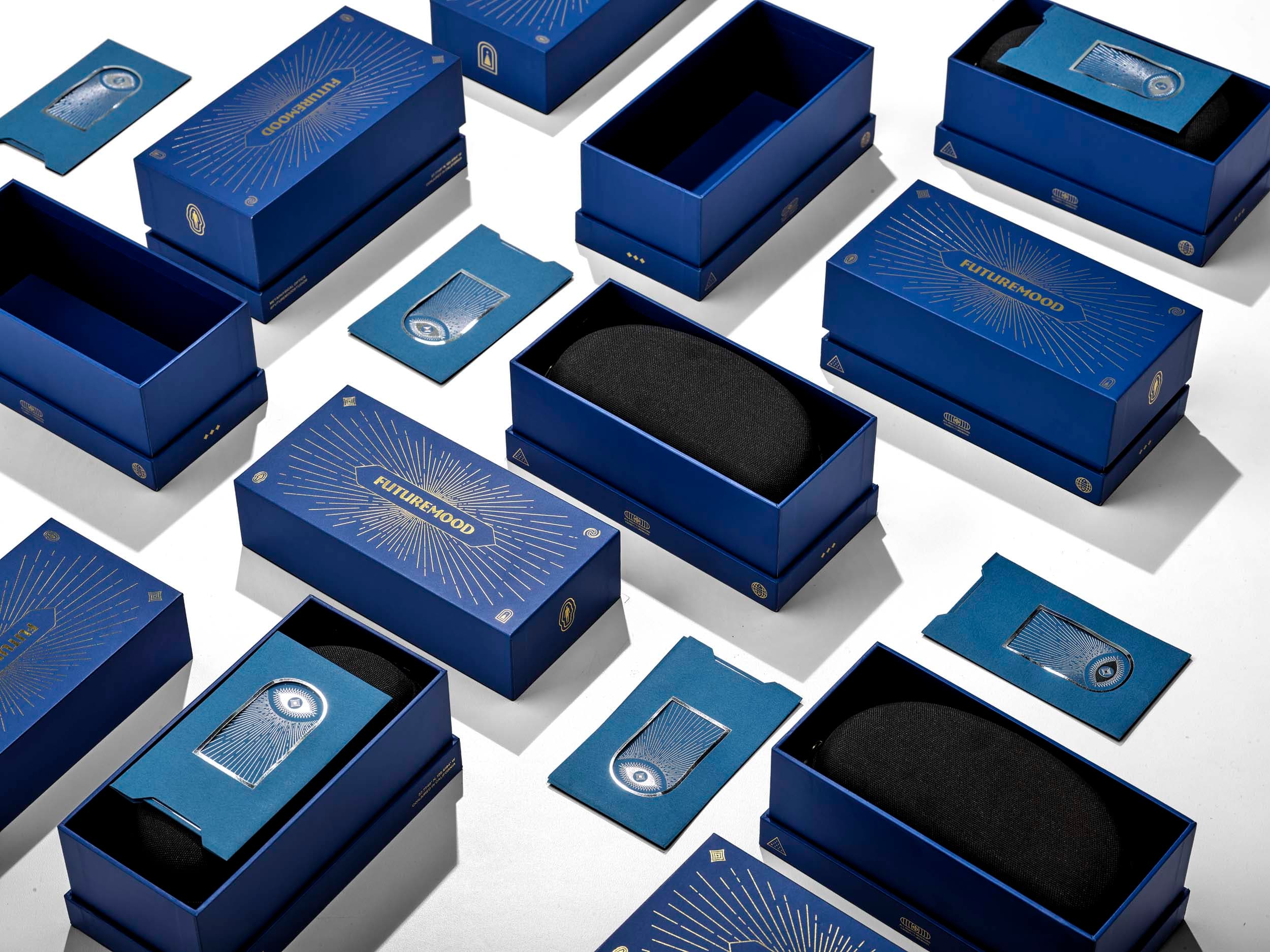 Futuremood premium rigid boxes with gold foil and foam inserts — finished production quality
